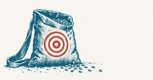A coarse cloth seed bag standing open with grain spilling at its foot, printed in teal ink, with an archer's target of concentric rings painted on its front in red